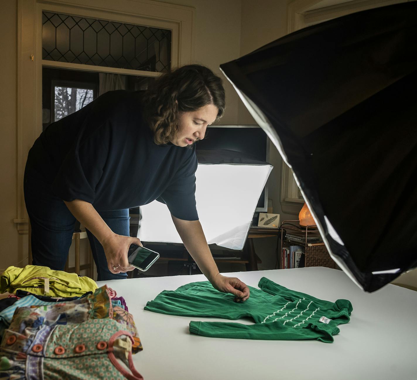 Shara Aatsap sorts through some clothing about to go online .]As we enter holiday shopping season, more people will be heading to resale websites and secondhand stores to buy their holiday outfits, and maybe, just maybe even Christmas gifts. RICHARD TSONG-TAATARII &#xa5; richard.tsong-taatarii@startribune.com