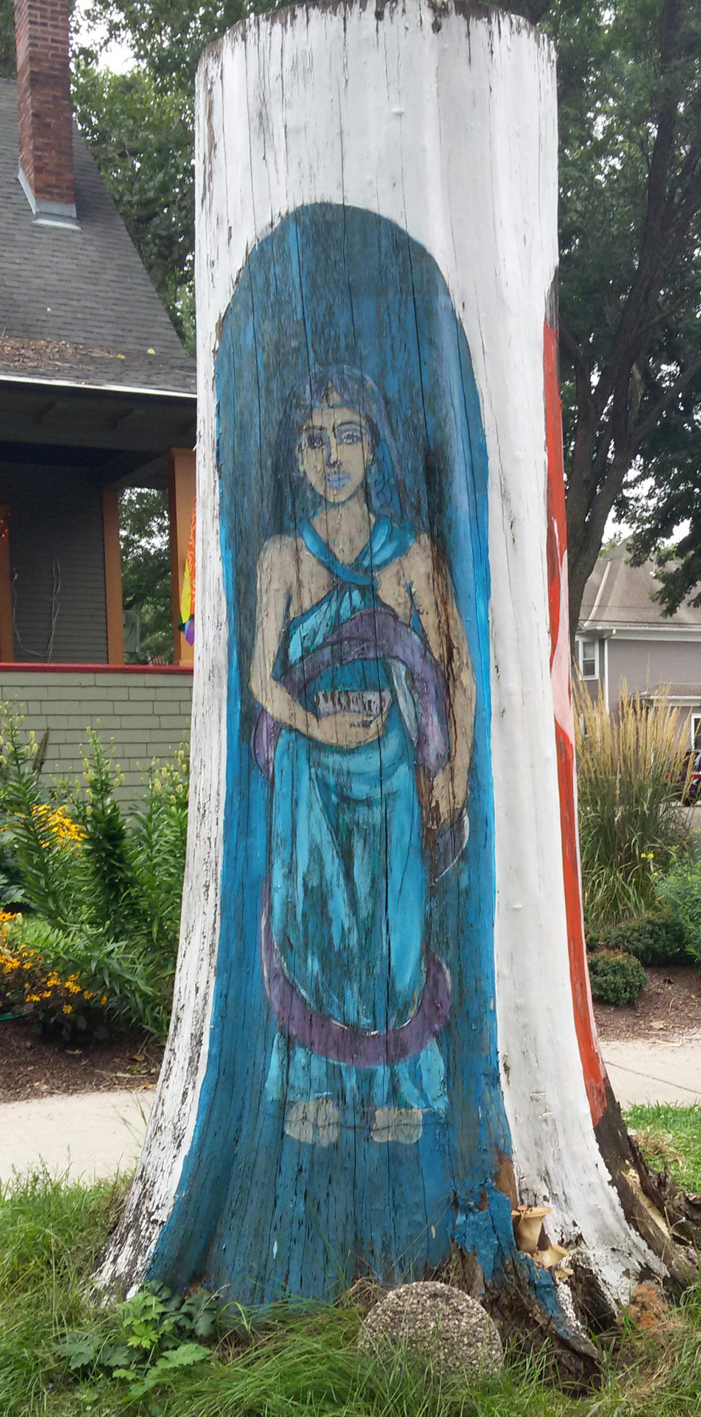 Hend Al-Mansour had three figures painted on the tree trunk that once stood in front of her home in the Union Park area of St. Paul, including one that upheld the Hand of Fatima to dispel the evil eye.]RichardTsong-Taatarii richard.tsong-taatarii@startribune.com