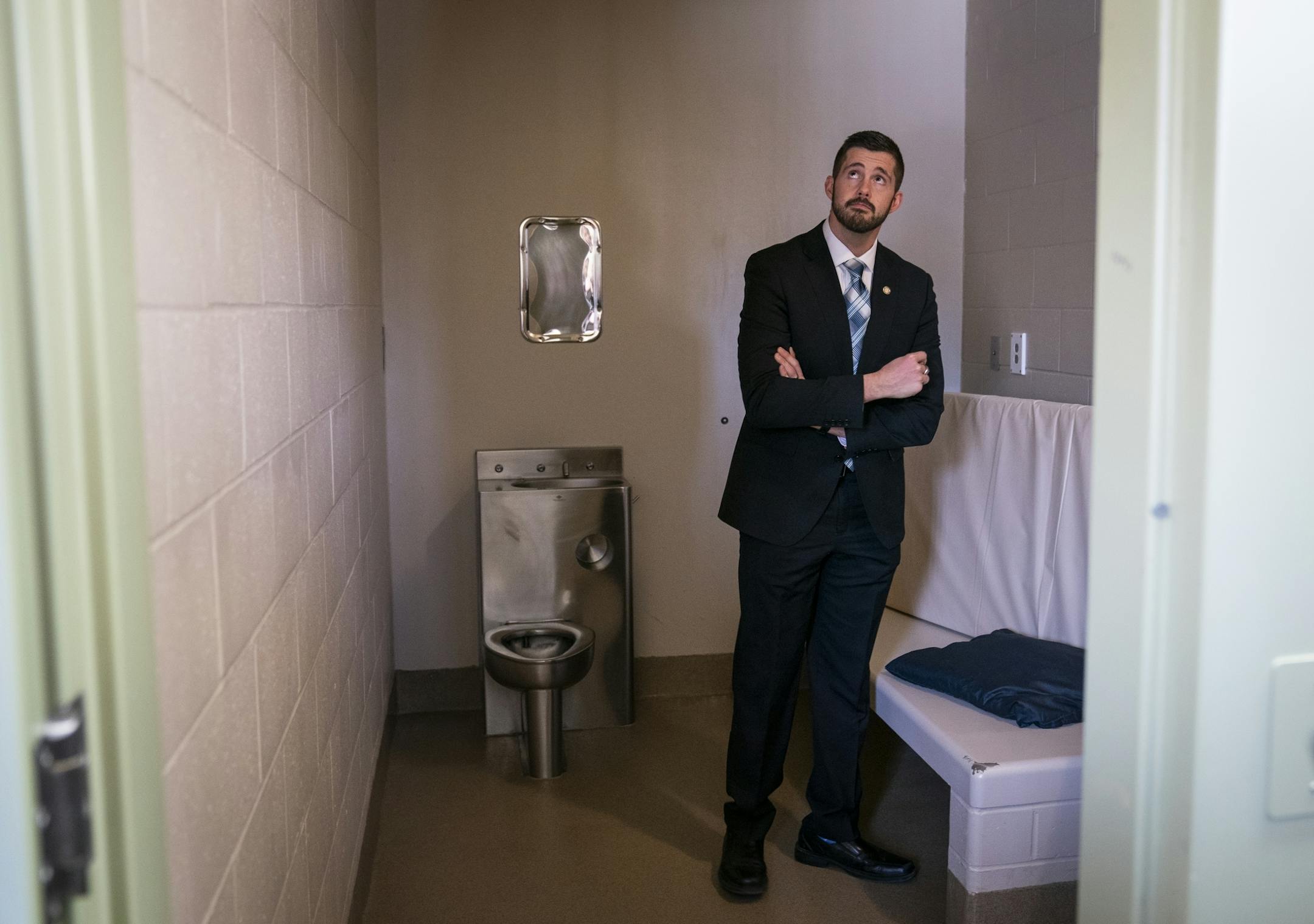 Rep. Dan Wolgamott stood inside a cell in the segregation unit at Stillwater prison during the tour Jan. 25.