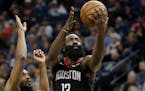 Houston Rockets guard James Harden (13) shoots on against Minnesota Timberwolves guard Keita Bates-Diop in the third quarter during an NBA basketball 
