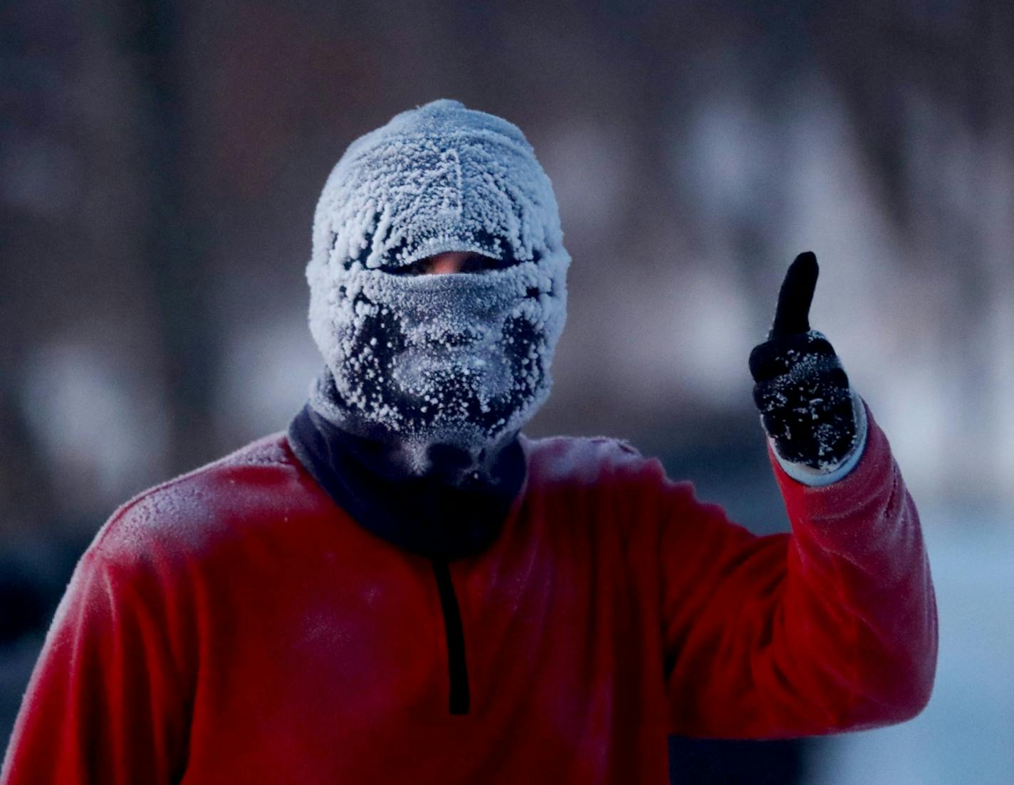 Chris, who declined to give his last name because he was concerned "people might think I'm crazy," gave a thumbs up while jogging around Lake Harriet with a head full of frost in sub 20 degree temps Thursday, Jan. 31, 2019, In Minneapolis, MN. Chris says he jogs daily no matter the whether and that in extreme cold the key is to keep moving.