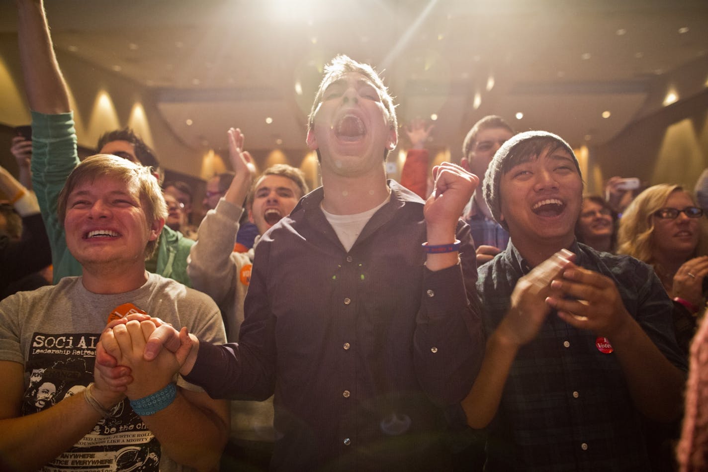 Anthony Streiff, Alex Sand and Nam Dorjee celebrated as it was announced that the Marriage Amendment had been defeated at the Minnesotans United for All Families election night results-watching event at the St. Paul RiverCentre in St. Paul, Minn. on Tuesday November 6, 2012.