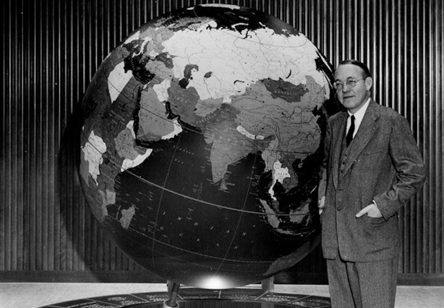 John Cowles, publisher, shows off the Star Tribune Globe in about 1951.