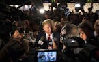 FILE - In this Aug. 6, 2015, file photo, Republican presidential candidate Donald Trump speaks to the media in the spin room after the first Republica