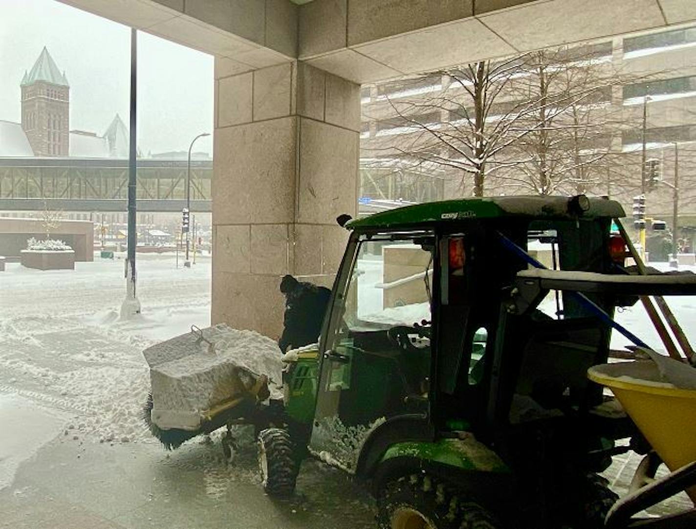 A nearly deserted downtown Minneapolis gave this snow removal worker a fighting chance to get his work done Sunday. Credit: Paul Walsh/Star Tribune