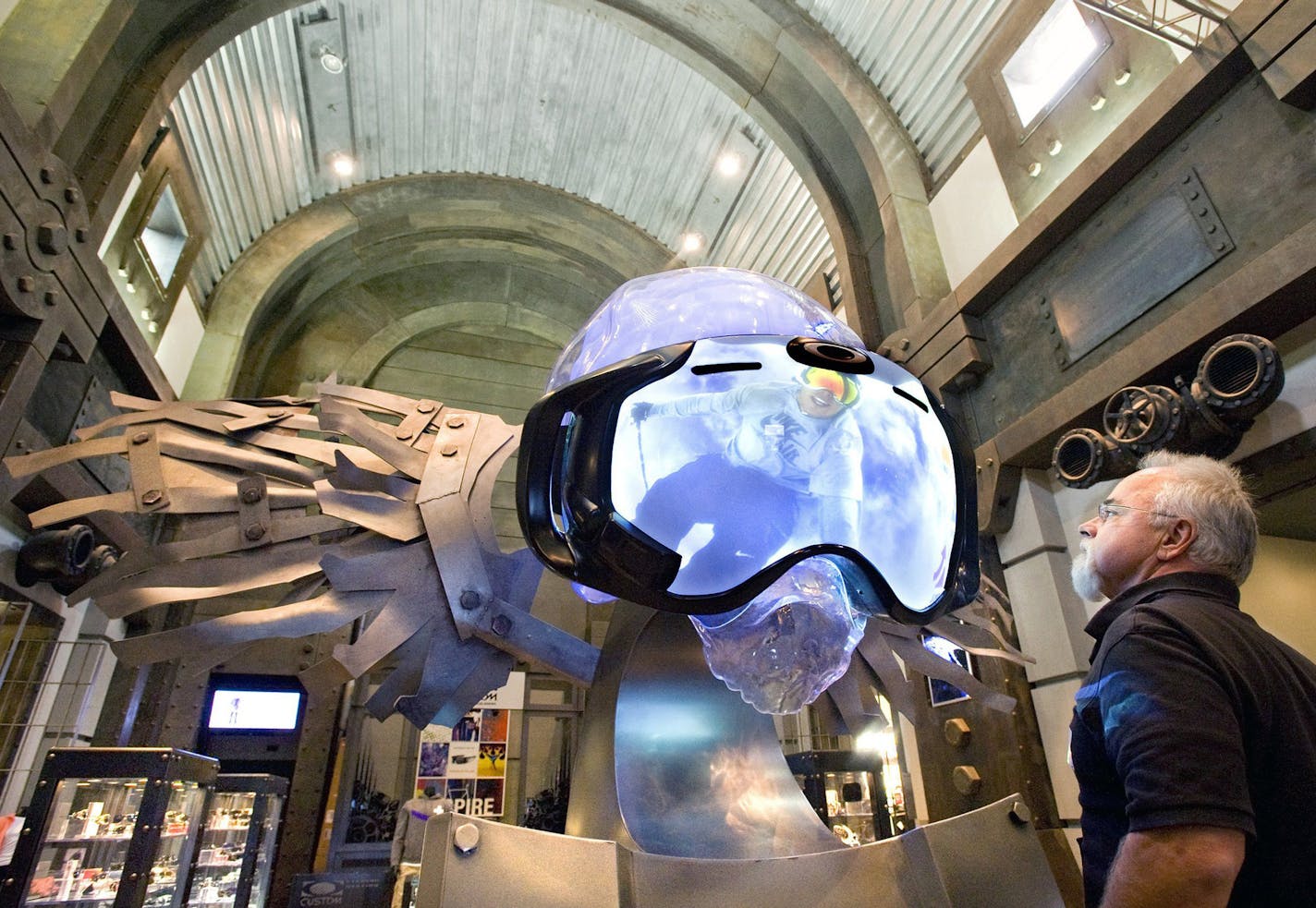 Vendor Eric Mihalik watches an Airwave 1.5 interactive display while waiting in the lobby of Oakley corporate headquarters. The display helps potential customers learn about the specialty goggles that are equipped with a heads-up display and onboard sensors. (H. Lorren Au Jr./Orange County Register/MCT) ORG XMIT: 1148019