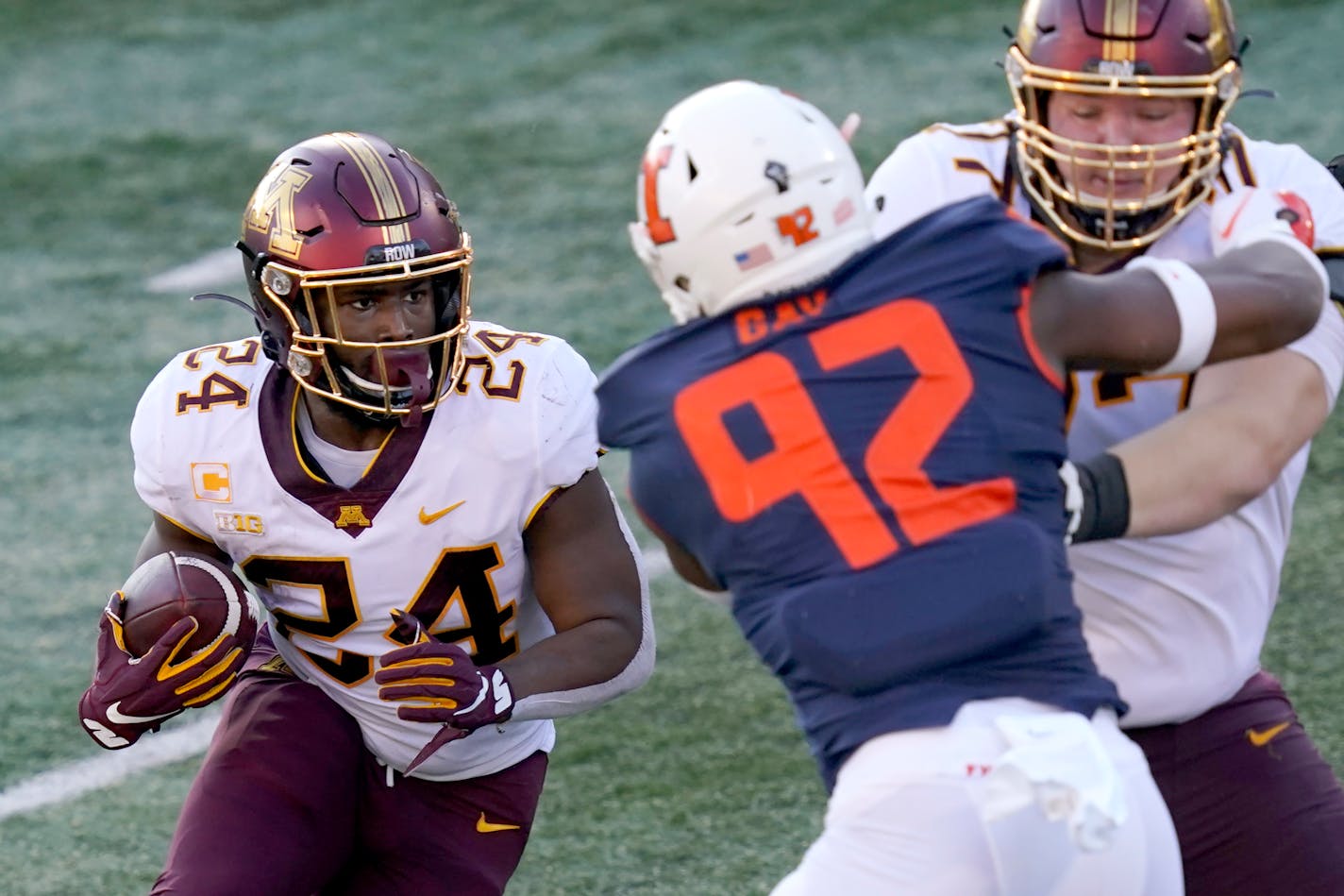 Minnesota running back Mohamed Ibrahim carries the ball during the first half