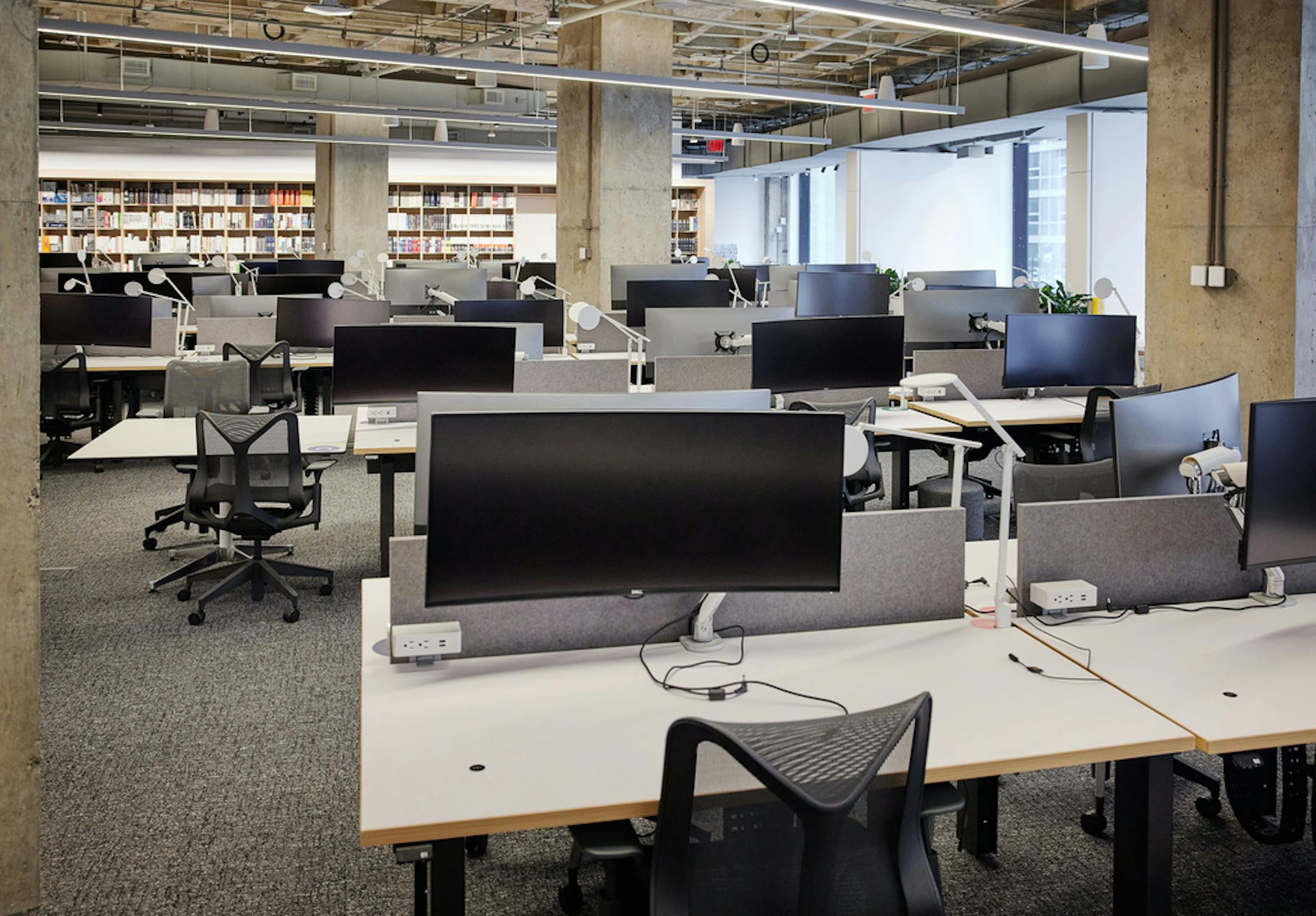 FILE — An empty office in New York, March 26, 2021. Before the latest surge of coronavirus cases, few companies had announced vaccine mandates — but according to a survey released Wednesday, Sept. 1, most companies now have plans to require that employees get vaccinated by the end of the year. (John Muggenborg/The New York Times)