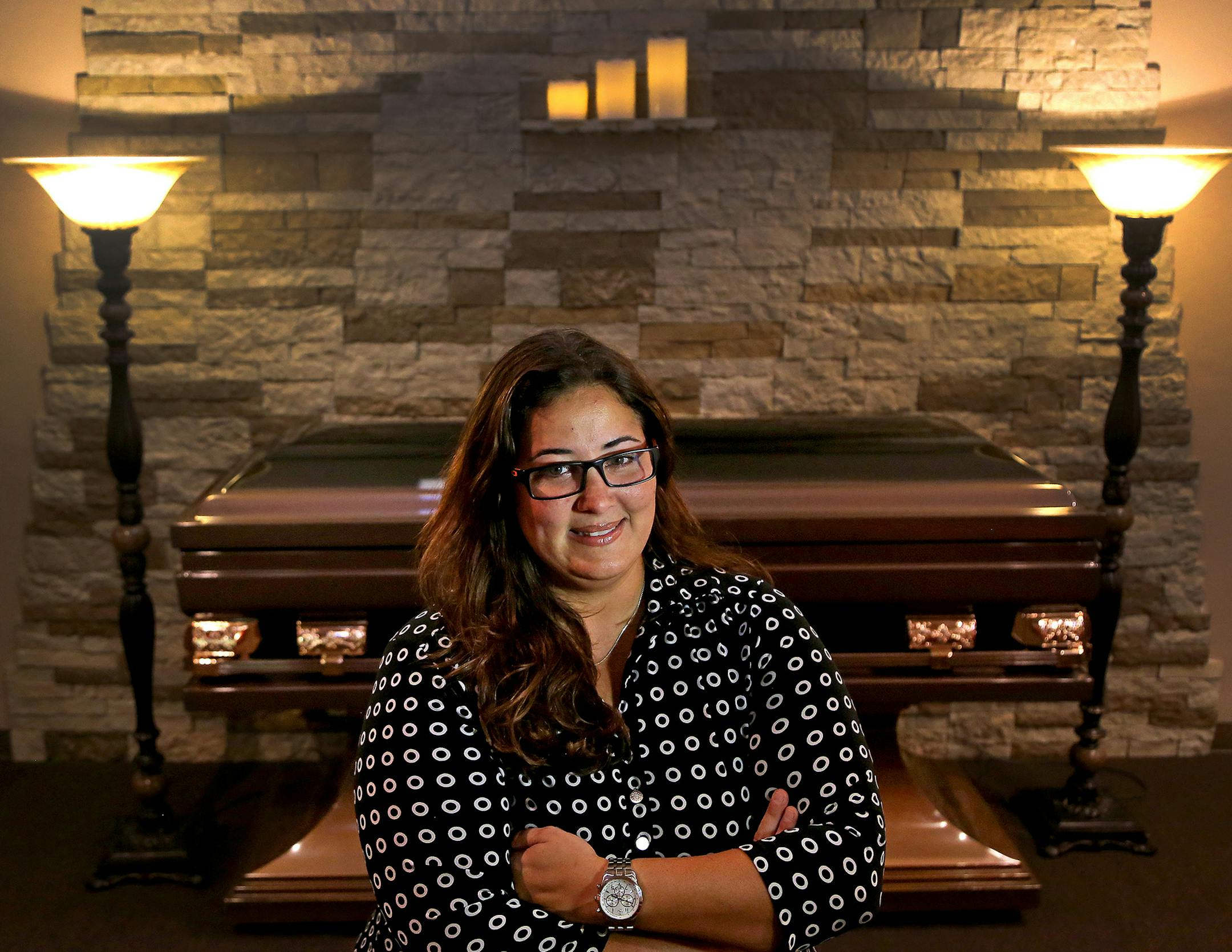 Keila Crucet, Funeral Director of Serenty Funeral Home & Cremation, poses for a portrait at the funeral home in Fort Lauderdale, Fla. Families in Broward and Palm Beach counties have been steadily moving away from traditional funeral services so funeral homes have gotten creative - many are now describing funeral directors as "grief counselors" who say funeral services help in the grieving process as opposed to wasting time and money. (Mike Stocker/Sun Sentinel/TNS) ORG XMIT: 1167427
