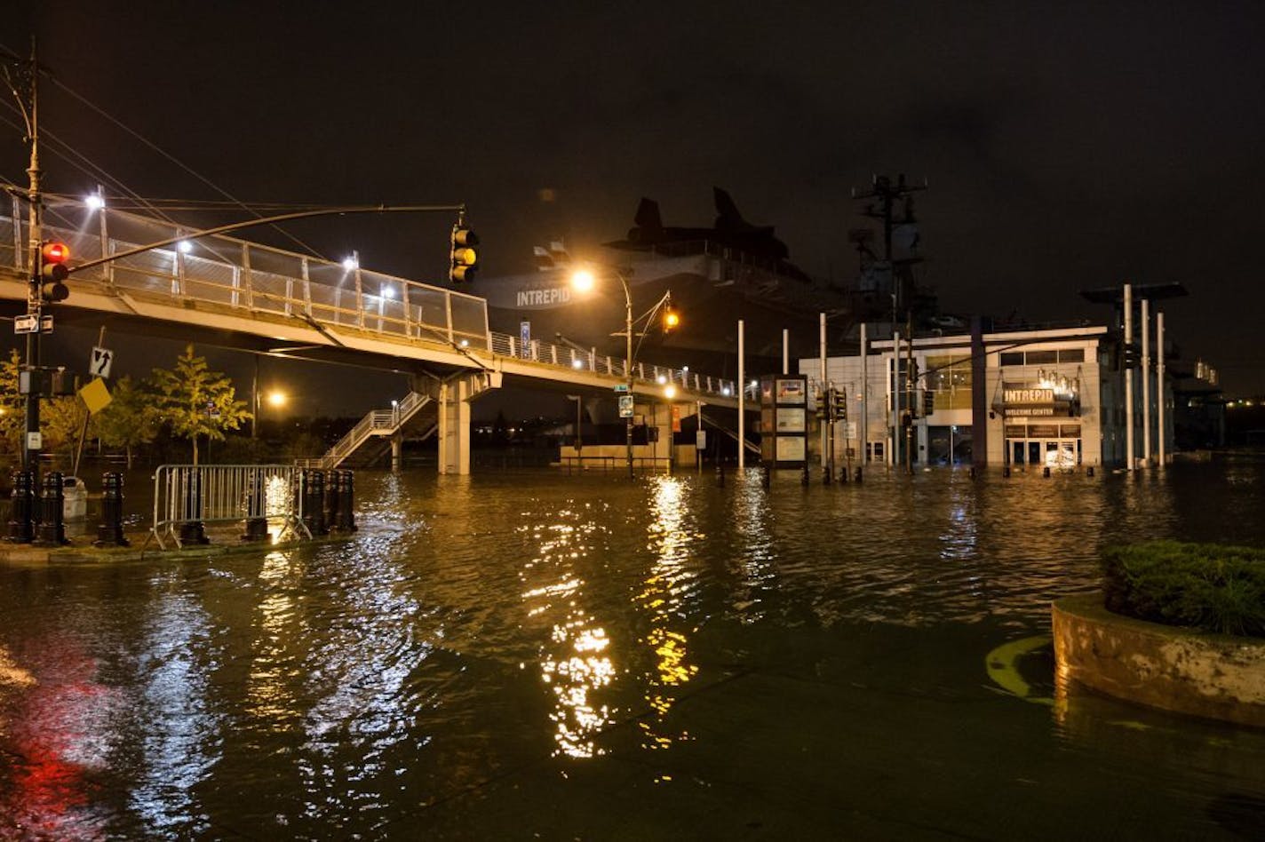 FILE - This Monday, Oct. 29, 2012, file photo provided by Dylan Patrick shows flooding along the Westside Highway near the USS Intrepid, background center, as Superstorm Sandy moves through the area. NASA spokeswoman Lisa Malone said Friday, Nov. 2, 2012, officials with the Intrepid Sea, Air and Space Museum told the space agency the space shuttle Enterprise suffered minor damage during Superstorm Sandy which struck on Monday. (AP Photo/Dylan Patrick) MANDATORY CREDIT: DYLAN PATRICK