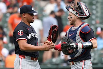 Twins pitcher Jhoan Duran, a key figure in a dominating bullpen, celebrates with catcher Ryan Jeffers after closing Thursday's victory.