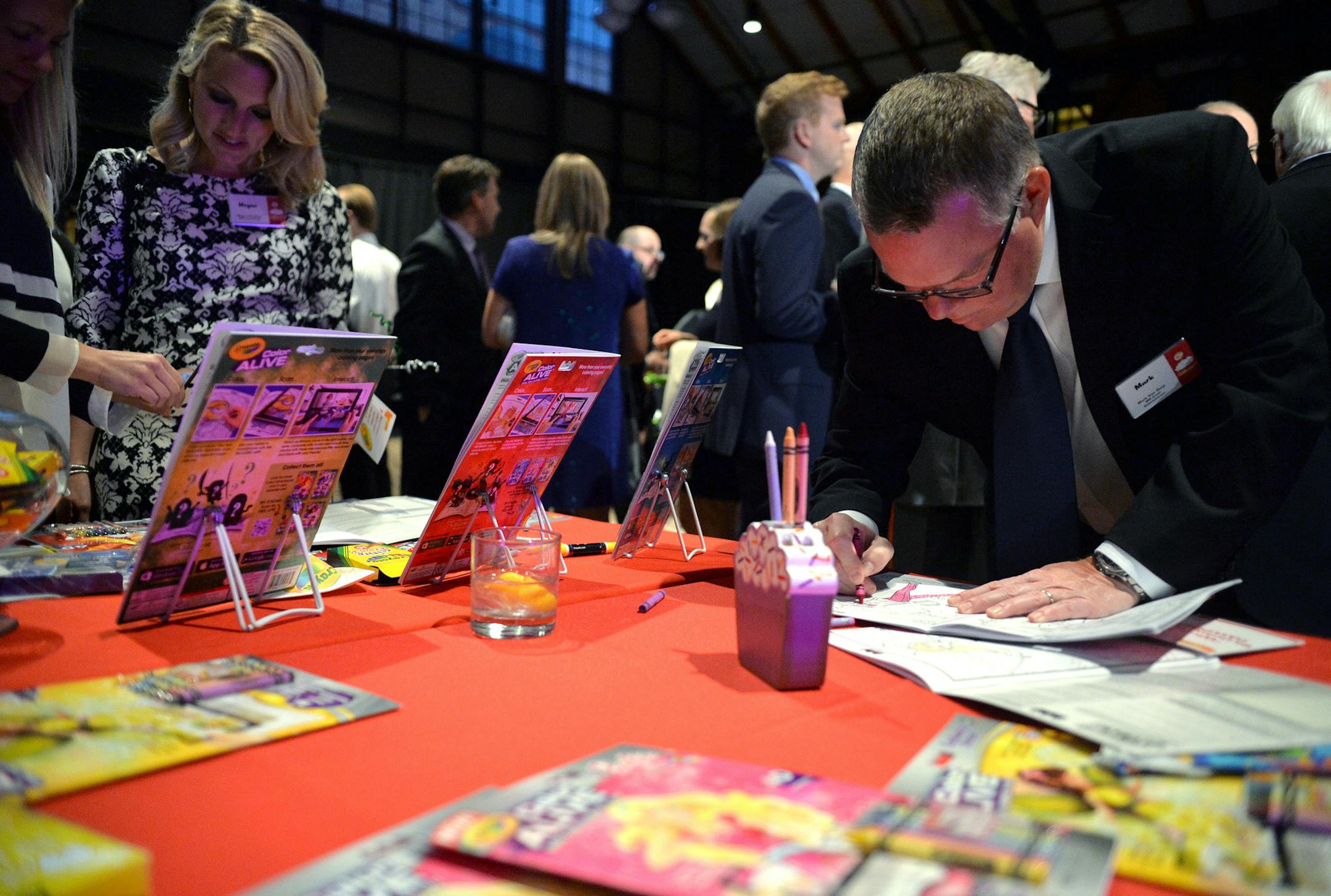 Mark Van Gorp showed off his artistic skills at a coloring book station at the Kids in Need 20th birthday gala.