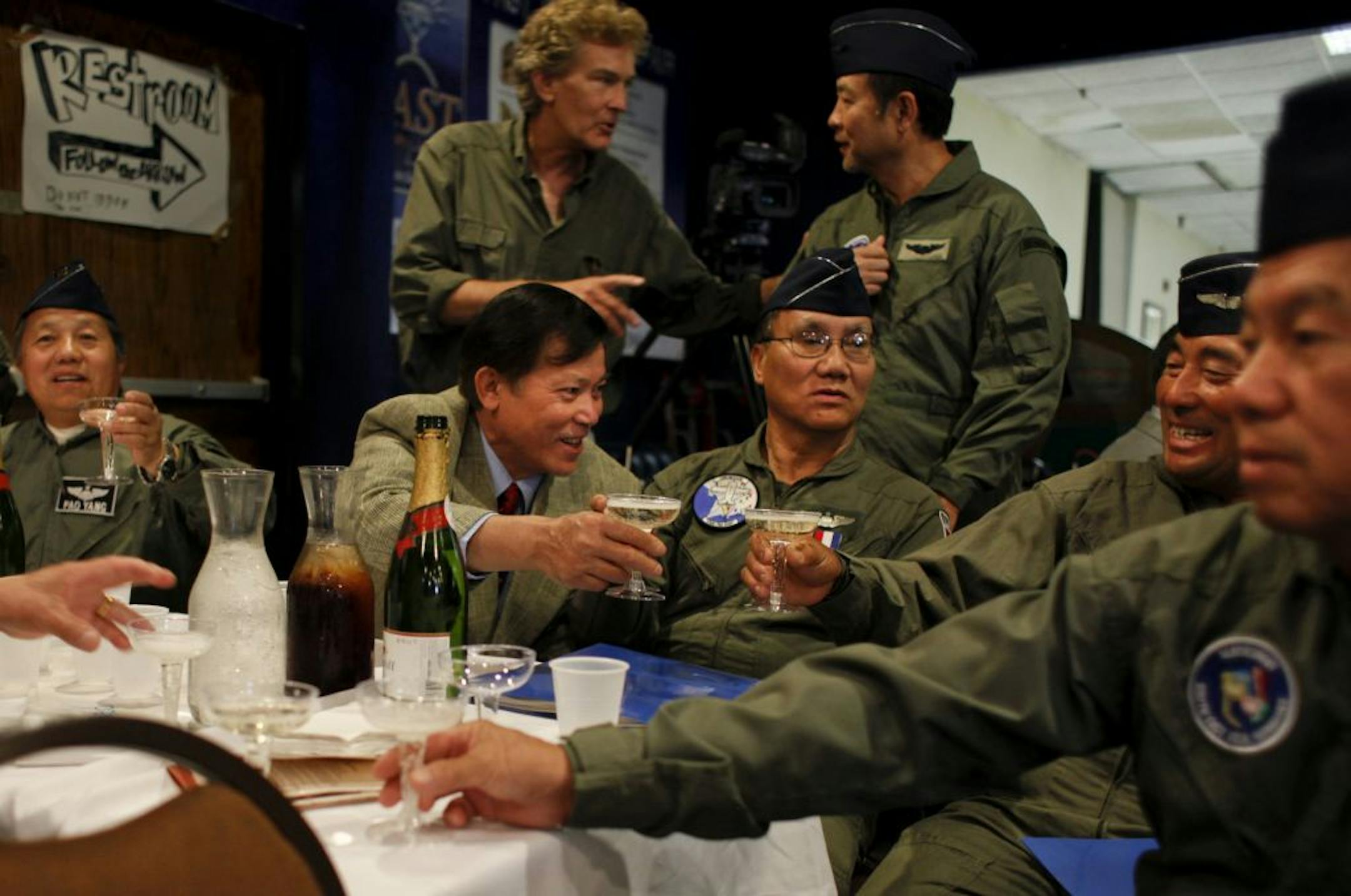 To close the award ceremony, surviving T-28 pilots clink their glasses to toast to their recognition by the U.S. Air Force in Maplewood, Minn. on Saturday, June 16, 2012.