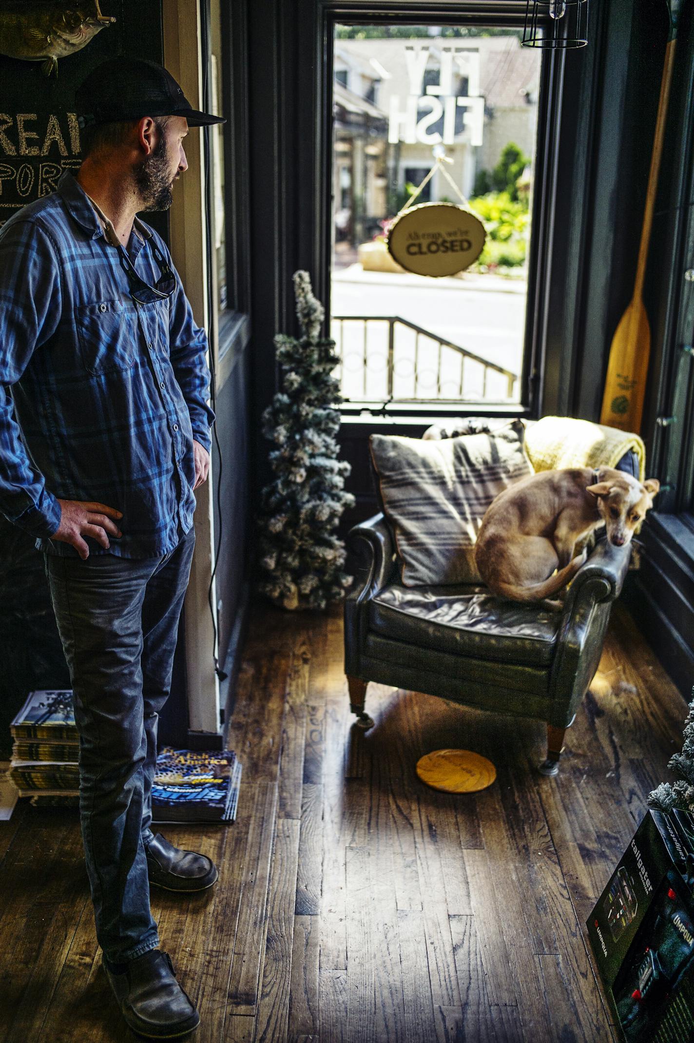 Robert Hawkins of Bob Mitchell's Fly Shop helped his red heeler dog Hazel settle in a sunny spot. Hawkins lives in St. Paul and has owned the shop for the last couple years.Lake Elmo is a small village whose image contrasts with the sprawling city of Woodbury.]Richard tsong-taatarii/rtsong-taatarii@startribune.com