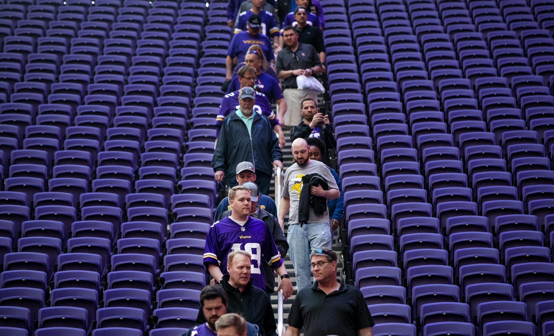 Fans walked down to the field level at the Minnesota Vikings draft party held at US Bank Stadium.