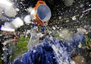 Kansas City Royals catcher Salvador Perez dumps water on manager Ned Yost after Game 5 of the Major League Baseball World Series against the New York 