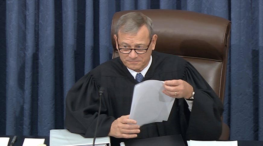 In this image from video, presiding officer Supreme Court Chief Justice John Roberts speaks during the impeachment trial against President Donald Trump in the Senate at the U.S. Capitol in Washington, Tuesday, Jan. 21, 2020. (Senate Television via AP)