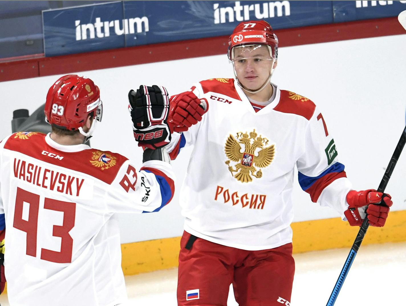 Russia's Alexei Vasilevsky, left and teammate Kirill Kaprizov celebrate Kaprizov's opening goal, during the Hockey Euro Hockey Tour Karjala Cup match between Czech Republic and Russia in Helsinki, Finland, Sunday, Nov. 11, 2018. (Heikki Saukkomaa/Lehtikuva via AP)