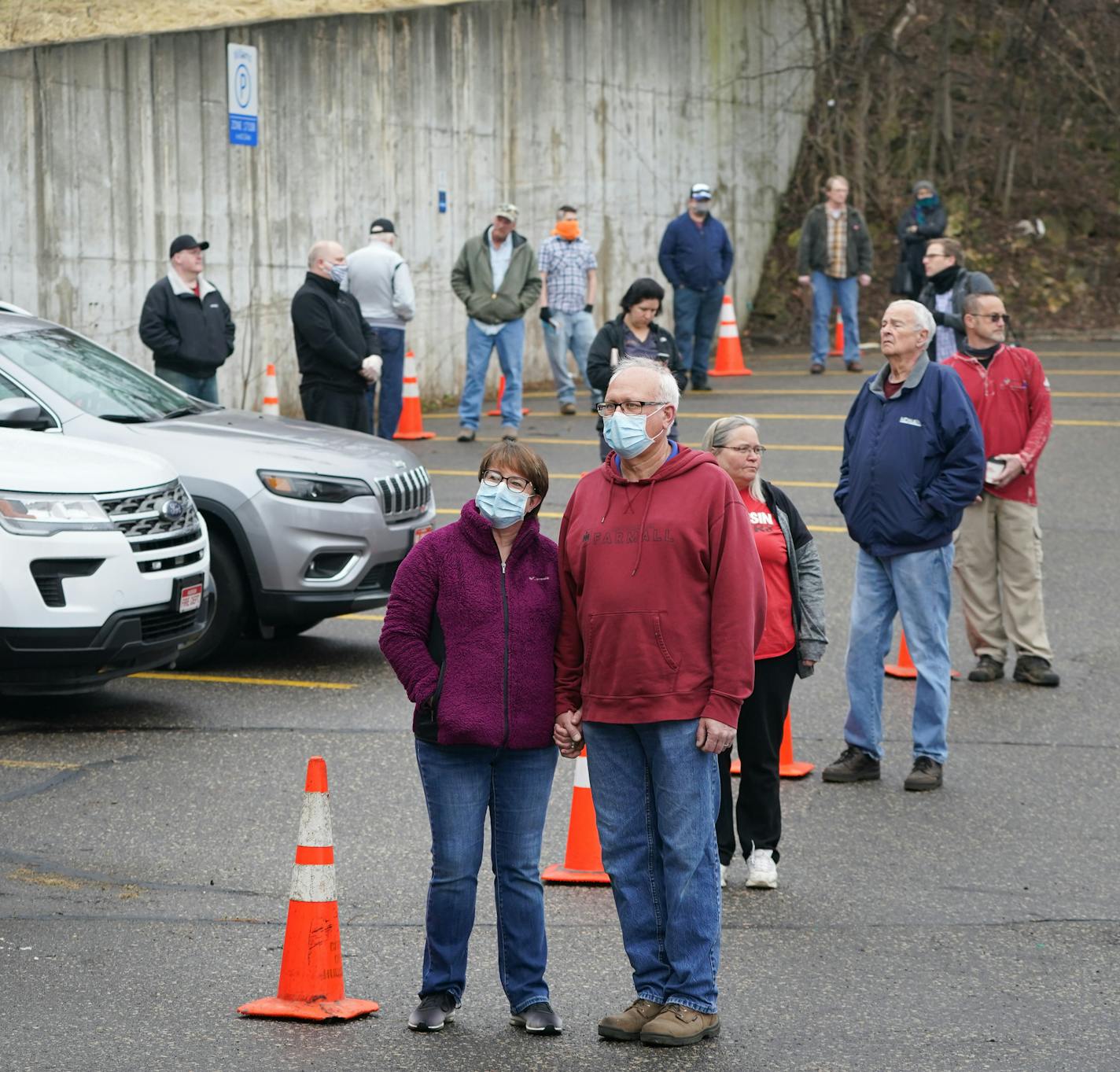 Brenda and Mike Drinken of Hudson, Wisconsin held hands as they waited in line to vote Tuesday morning. Voters in Hudson, Wisconsin were allowed into the firehouse one by one to vote in Tuesday's primary. They lined up next to cones in the parking lot that were ten feet apart. They started at a hand washing station and voting equipment was sanitized after each voter. ] GLEN STUBBE &#x2022; glen.stubbe@startribune.com Tuesday, April 7, 2020 Wisconsin's primary election goes on on Tuesday, despite