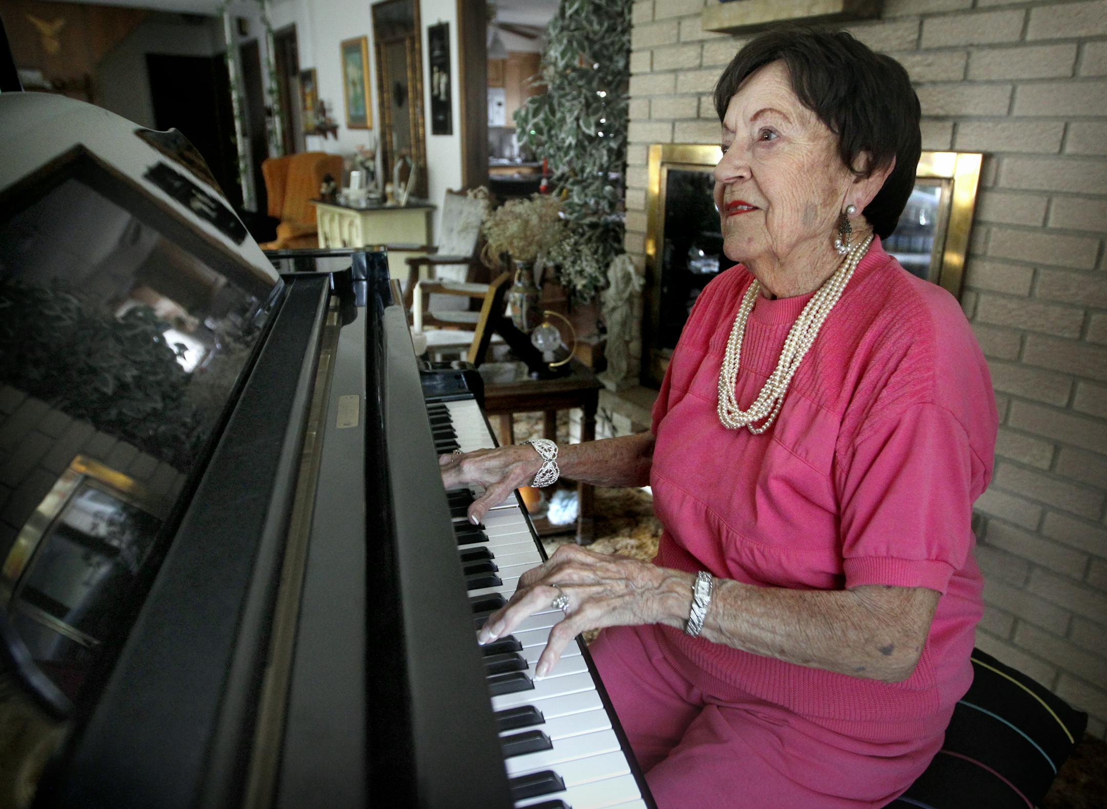 Jeanne Arland Peterson, a music legend in the Twin Cities/USA and Matriarch of 5 talented musical kids, in her home on her 90th Birthday. ] TOM WALLACE &#x2022; twallace@startribune.com __Assignments #20019300A_ August 16, 2011_ SLUG: peterson0820_ EXTRA INFORMATION: Jeanne Arland Peterson a music legend in the Twin Cities/USA and Matriarch of 5 talented musical family, turned 90 Tuesday. Named (CQ) from the internet and card from her home