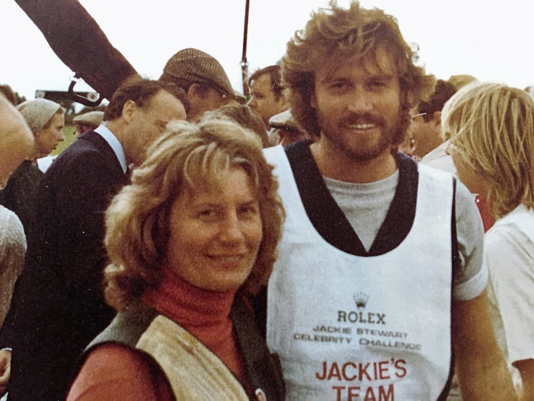 Around the world, nearly everyone who shot trap wanted to call for targets alongside Loral I Delaney, a national and world champion trapshooter. Many did, but few could beat her, including Barry Gibb of the Bee Gees, shown here with Loral I in Great Britain.