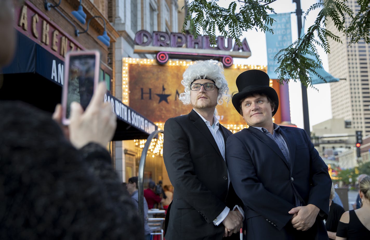 Benjamin Rosas, of Stillwater, dressed as George Washington and his brother Drew Rosas, of Los Angeles, dressed as John Quincy Adams, got their picture taken by their mom Maren Rosas, of Stillwater in front of the Marquee as arrived at opening night of Hamilton at the Orpheum Theatre in Minneapolis, Minn., on August 29, 2018. ] RENEE JONES SCHNEIDER &#x2022; renee.jones@startribune.com