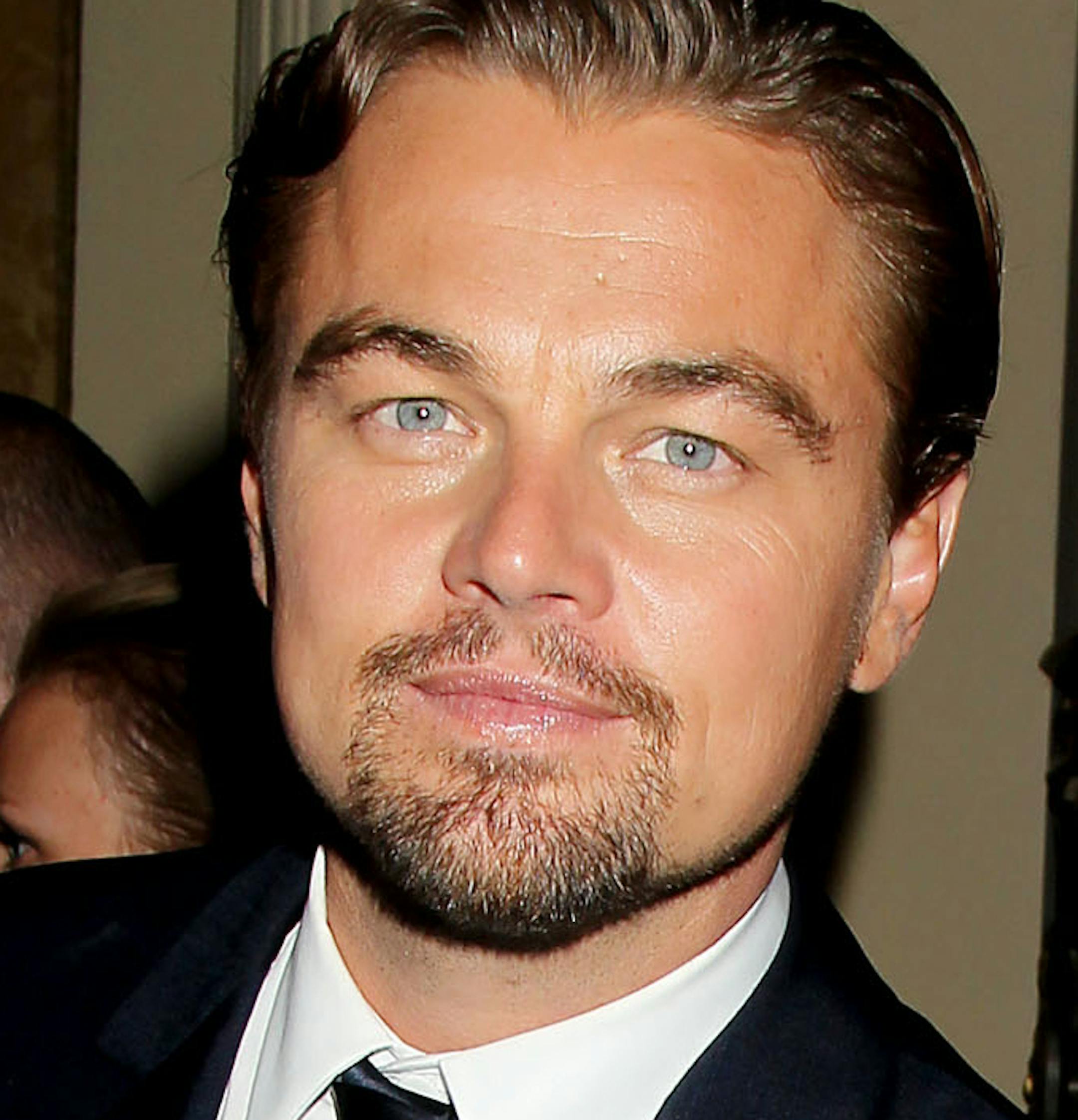 This May 1, 2013 photo released by Starpix shows actor Leonardo DiCaprio, left, and rapper-businessman Jay-Z at the after party for the premiere of "The Great Gatsby," sponsored by Moet & Chandon, in New York. The film, based on the novel by F. Scott Fitzgerald, opens nationwide on May 10. (AP Photo/Starpix, Dave Allocca) ORG XMIT: MIN2013050819043337 ORG XMIT: MIN1305081909091265