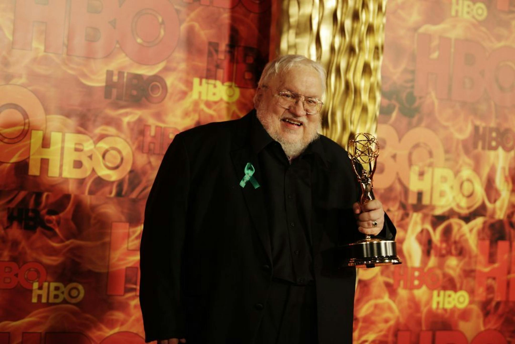 The �Game of Thrones� author, George R.R. Martin, with his Emmy at the HBO after party at the Pacific Design Center in West Hollywood, Calif., Sept. 20, 2015. After the 67th Primetime Emmy Awards on Sunday night, HBO gave a fire-themed party.