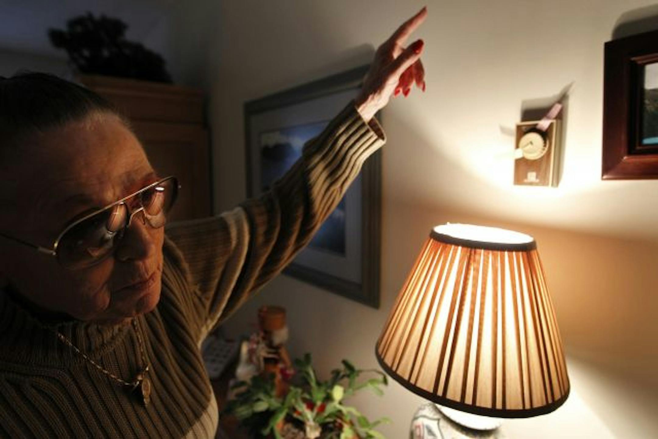 At her home, Ruth Ann Adams depends on LIHEAP funding to make ends meet. Here she points out where she has marked her themostat so she can turn off the heat and set it at a temperature that will not run up the gas bill.