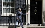 Britain's Home Secretary Theresa May gestures as she leaves after attending a cabinet meeting at 10 Downing Street, in London, Tuesday, July 12, 2016.
