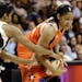 East's Angel McCoughtry, left, of the Atlanta Dream, pressures West's Maya Moore, of the Minnesota Lynx, during the first half of the WNBA All-Star ba