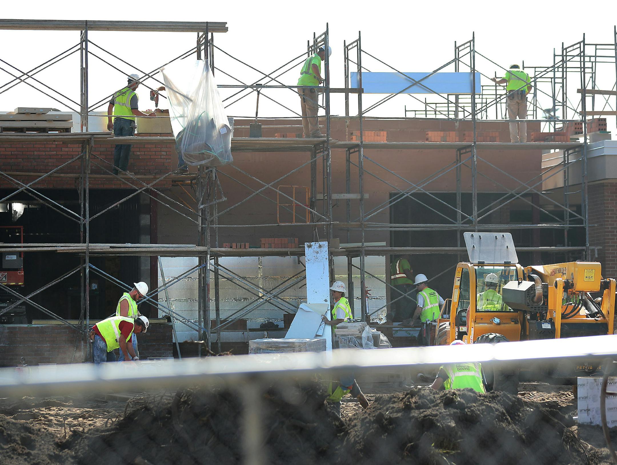 The construction sector performed the best as far as employment in Minnesota last month. Here, workers are renovating Irondale High School in the Mounds View district earlier this month. (DAVID JOLES/Star Tribune)