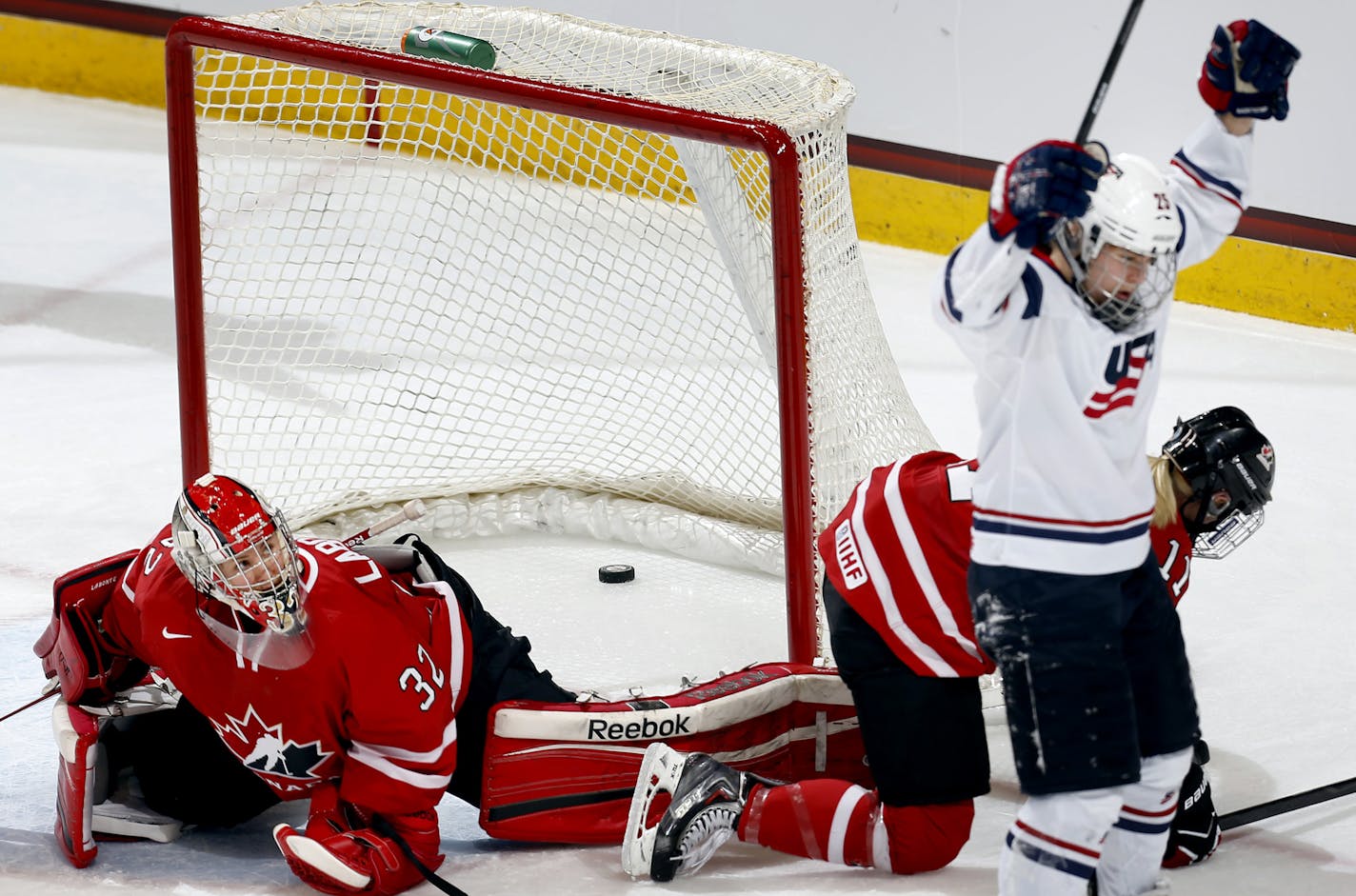 Alex Carpenter (25) of team USA celebrated after shooting the puck past team Canada goalie Charline Labonte (32) for a goal in the second period. USA beat Canada by in final score of 3-2 in an overtime shootout. ] CARLOS GONZALEZ cgonzalez@startribune.com - December 28, 2013, St. Paul, Minn., Xcel Energy Center, Womens Hockey, USA vs. Canada