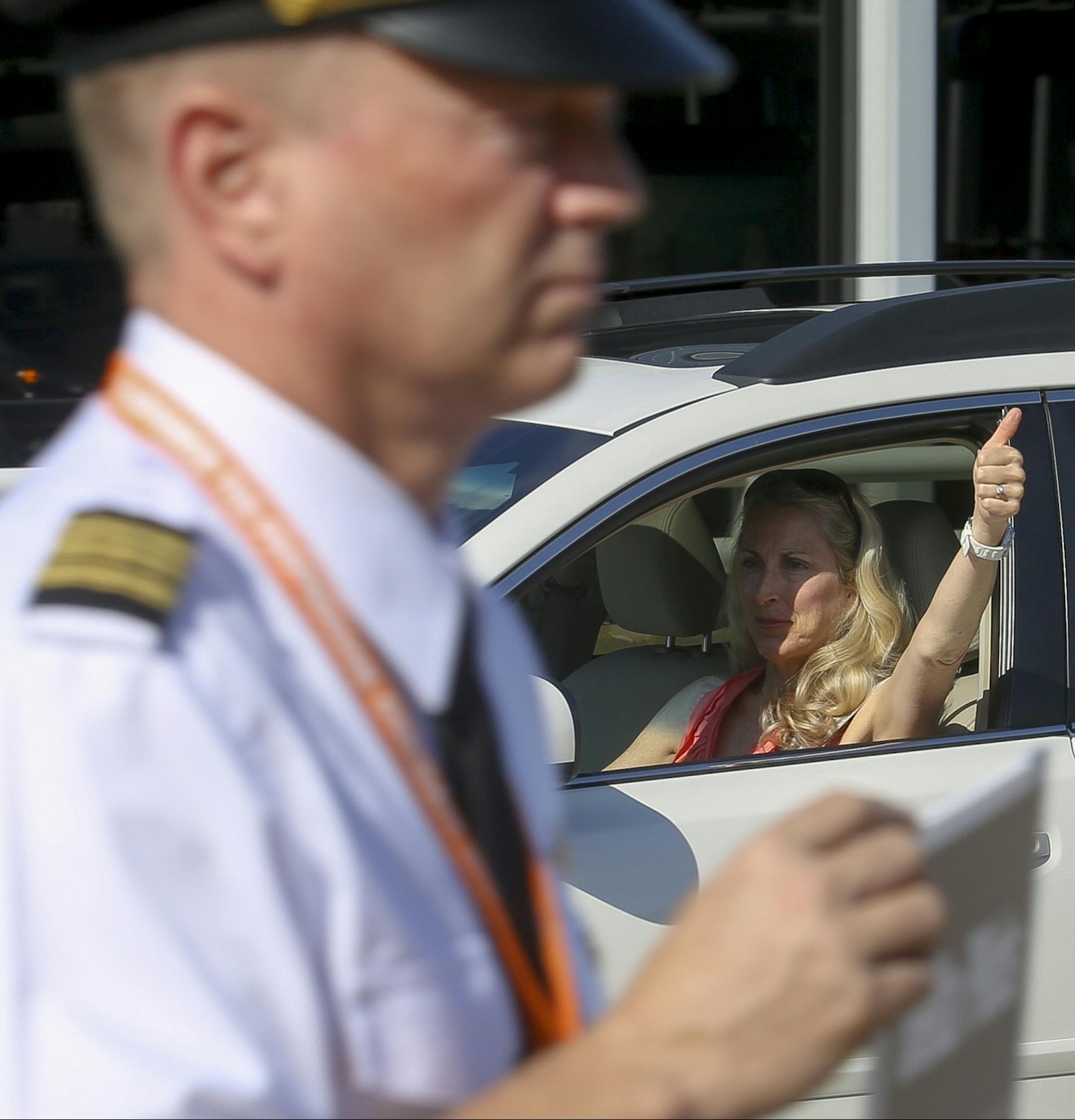 Passers by such as this woman honked their car horns, cheer and gave picketers a thumbs up as a sign of solidarity.