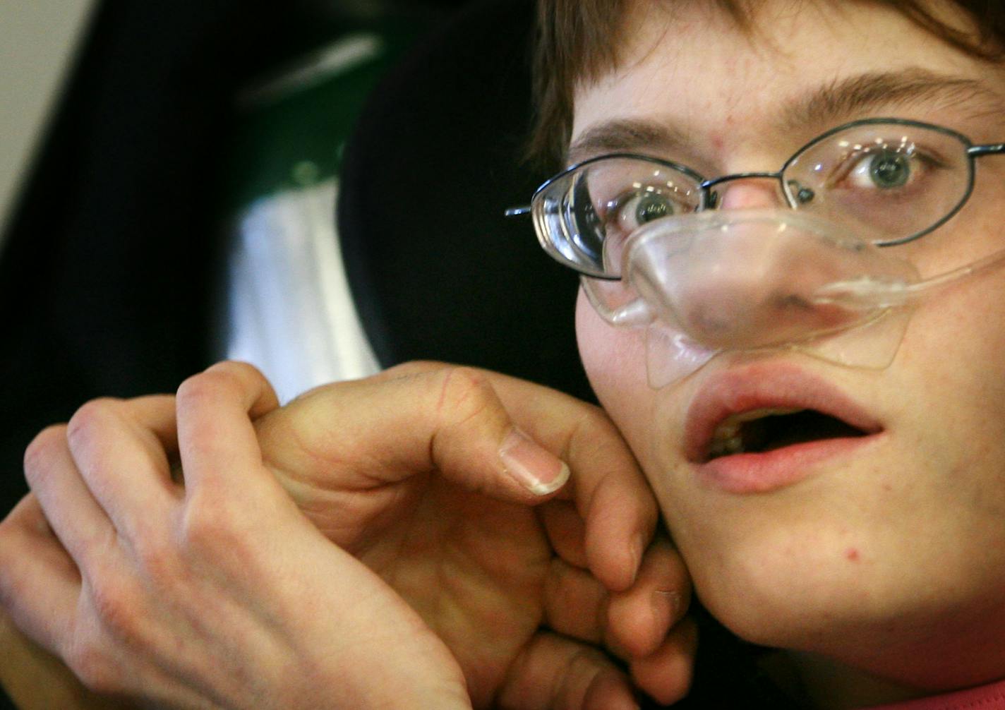 Stephanie, who uses an oxygen mask, is "a happy little girl," says her mother Brenda.