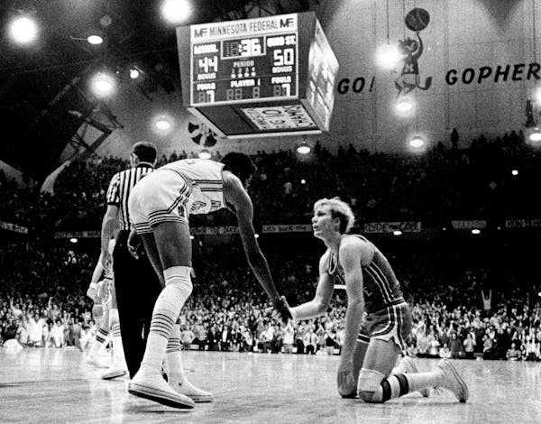 January 26, 1972 Corky Taylor Extends Helping Hand to Ohio State's Luke Witte Just Before Brawl, Witte had been fouled by Minnesota's Clyde Turner; Ta