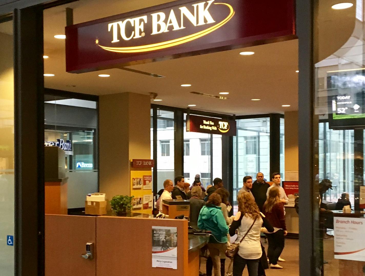 Customers queued up at TCF Bank's IDS Center branch over lunch hour on Monday.