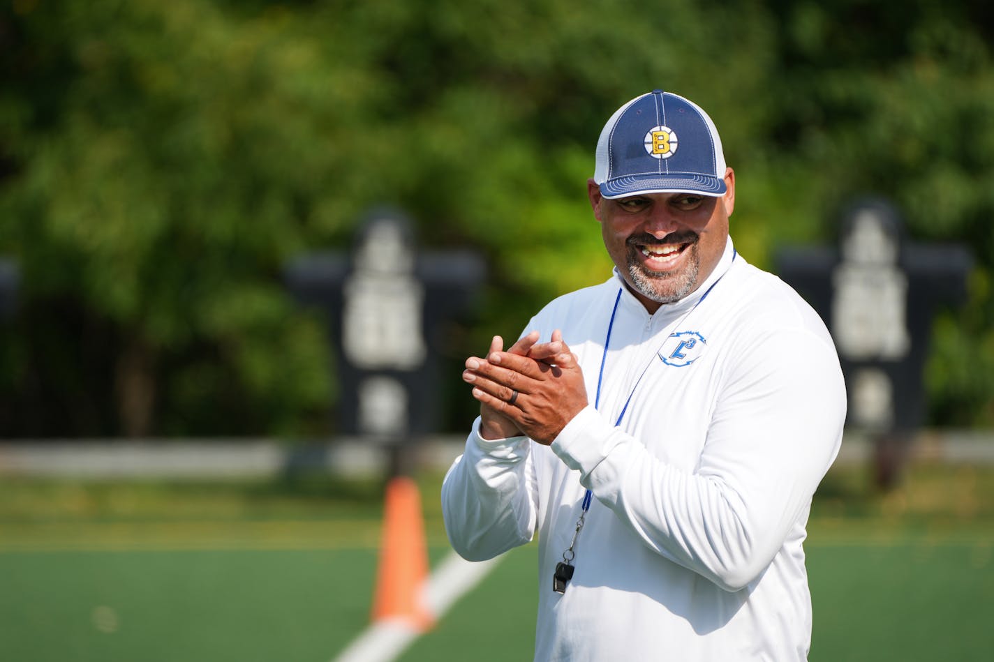 First-year coach Marcus Harris works with his players during Breck football practice, Tuesday, Sept. 6, 2022 in Golden Valley, Minn. ] SHARI L. GROSS / shari.gross@startribune.com