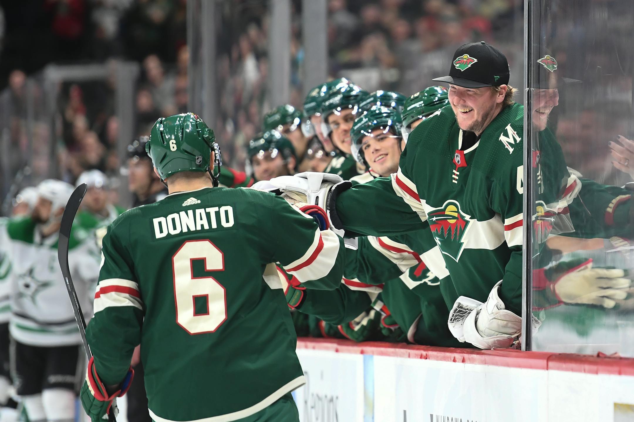 Wild goaltender Devan Dubnyk high fived center Ryan Donato