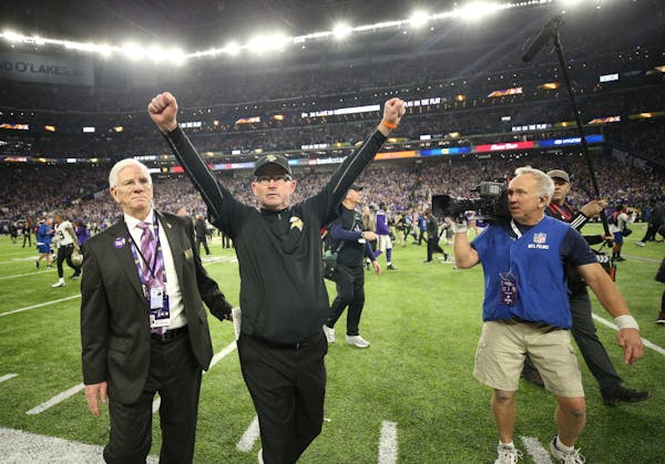 Vikings coach Mike Zimmer raised his arms in triumph after his team beat the New Orleans Saints on Sunday in the NFC divisional playoff game.