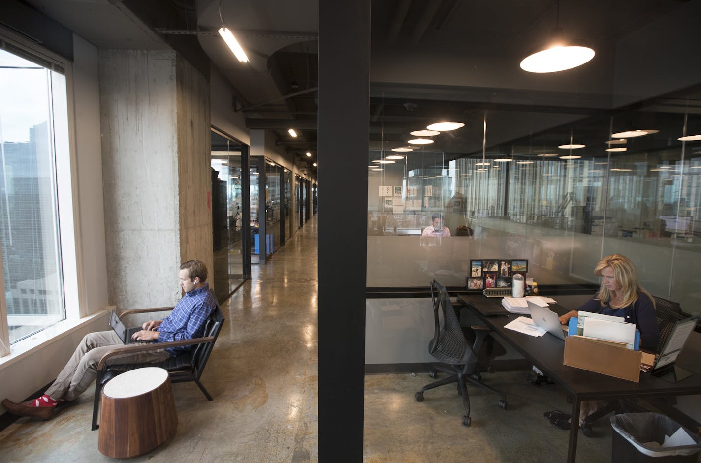 Greg Zeman of Branch Messenger worked in open space outside the office of Melissa DeLay of TruPerception at Industrious co-working space in RBC Plaza.