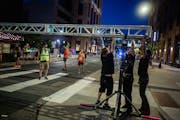 Officials start to take down infrastructure for the 10-mile race in Minneapolis on Oct. 1, 2023. The Twin Cities Marathon and 10-mile race were cancel