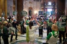 Rep. Kristin Bahner, DFL-Maple Grove, leads a cheer of ERA supporters outside the House chamber on Wednesday, ahead of a vote on the amendment.