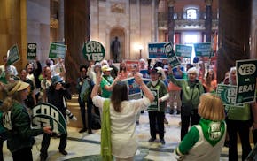 Rep. Kristin Bahner, DFL-Maple Grove, leads a cheer for ERA supporters outside the House chamber in St. Paul on May 15.