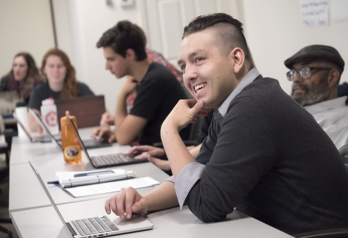 Student Josh Wyman enjoys a light moment in class at Luther Seminary, which announced a new fast track program for clergy training .