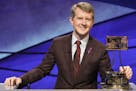 This image released by ABS shows contestant Ken Jennings with a trophy on "Jeopardy! The Greatest of All Time." Jennings will be the first interim gue