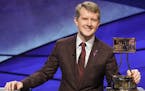 This image released by ABS shows contestant Ken Jennings with a trophy on "Jeopardy! The Greatest of All Time." Jennings will be the first interim gue
