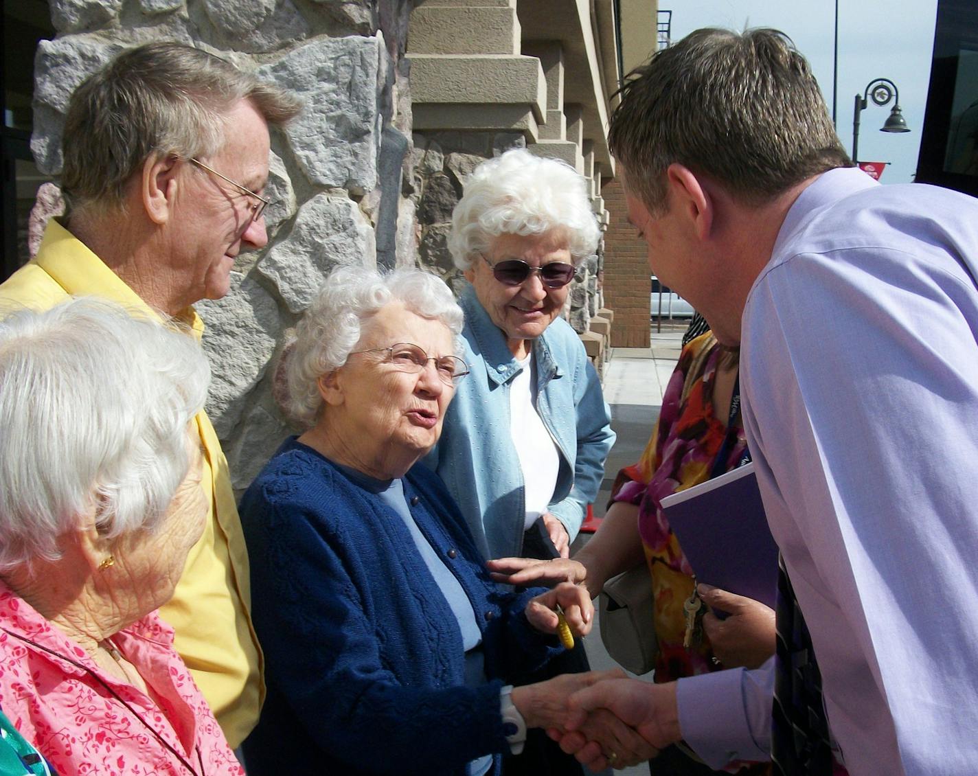 Joel Theisen, CEO of senior care services company Lifesprk, meets with a group of seniors. (Provided by Lifesprk)