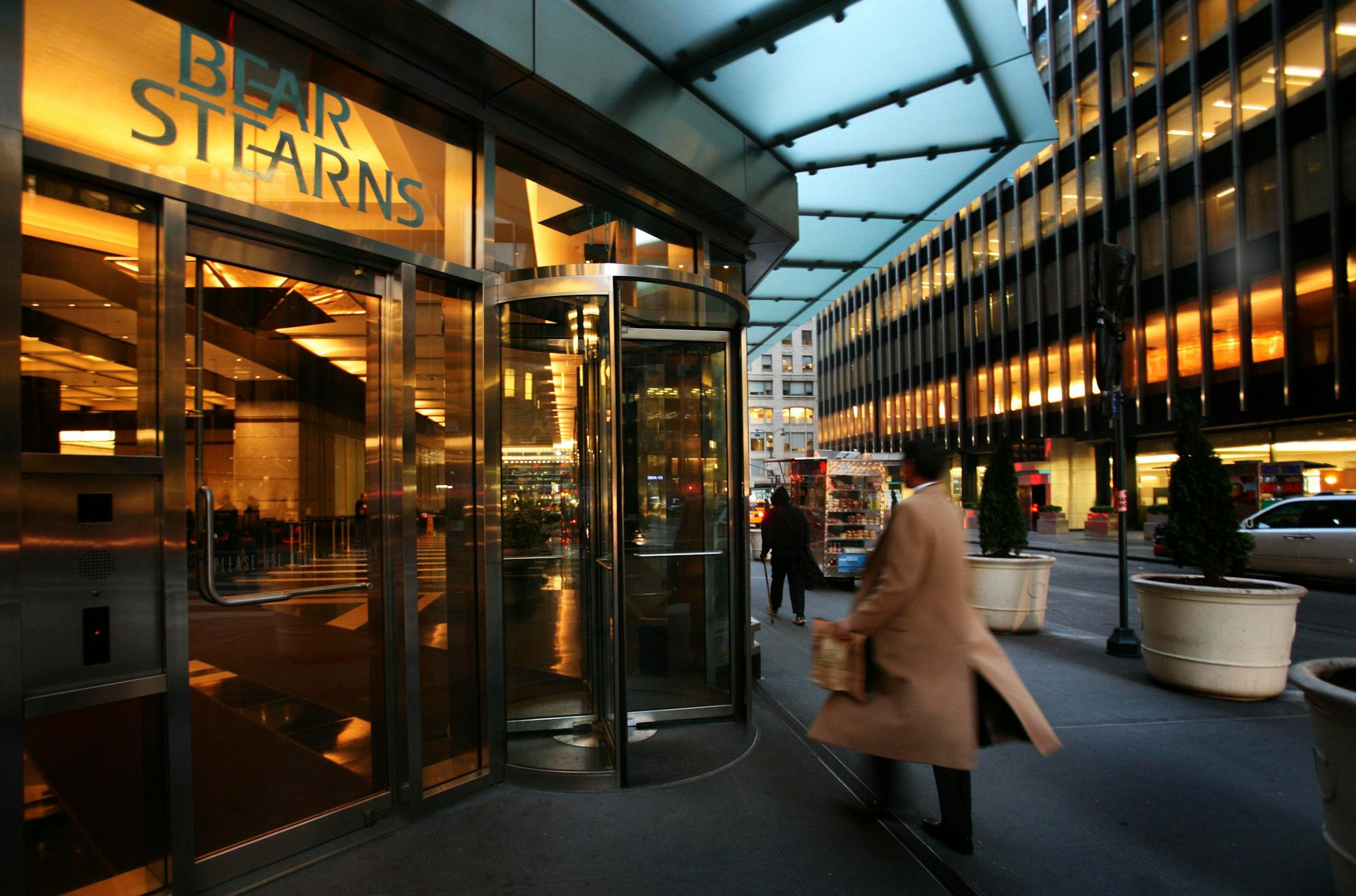 An employee entered Bear Stearns in New York Monday. J.P. Morgan Chase & Co. said Sunday it will acquire rival Bear Stearns for a bargain-basement $236.2 million — $2 a share — a stunning collapse for one of the world's largest and most storied investment banks.