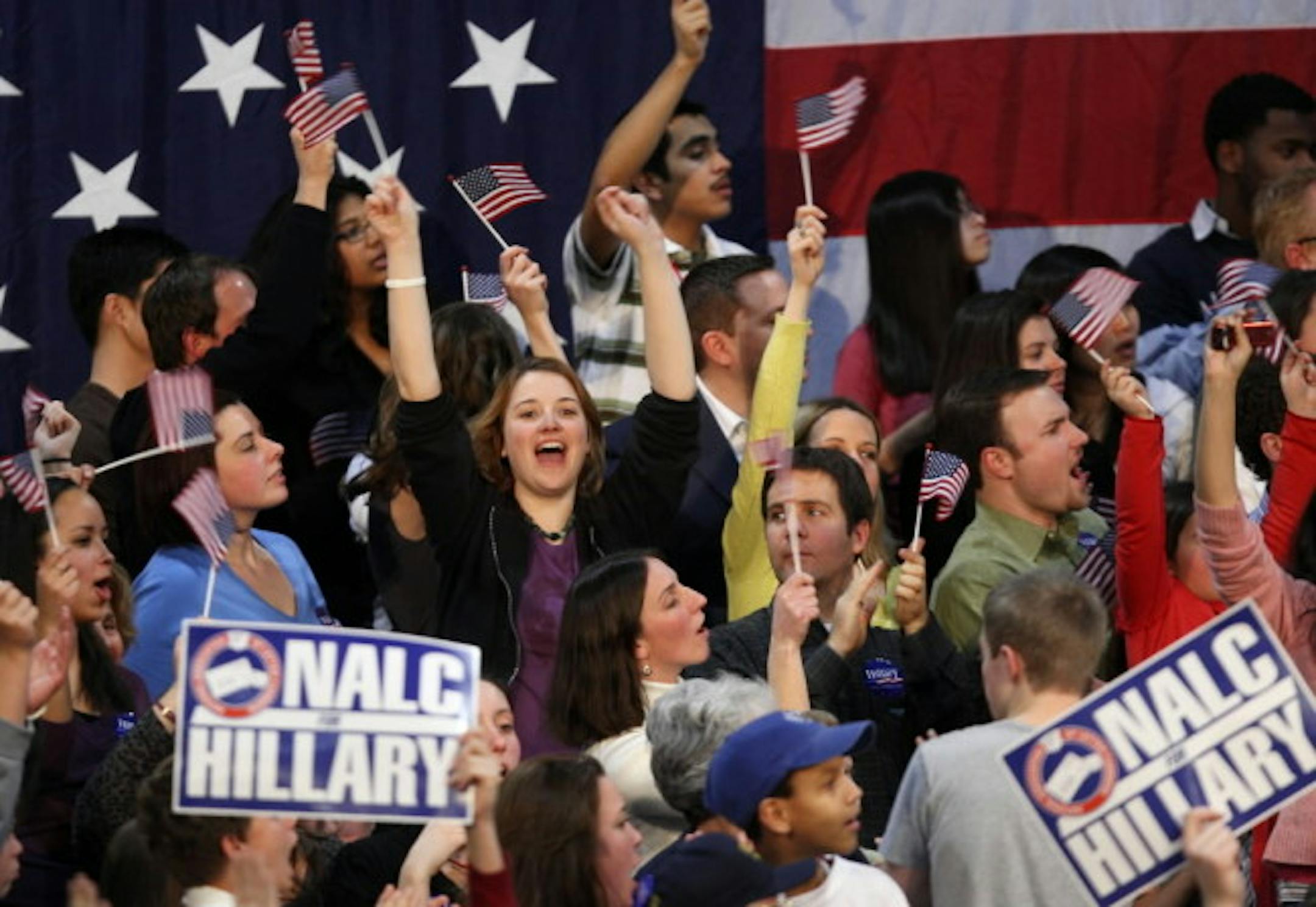 A crowd cheers as they watch election returns for Democratic presidential hopeful Hillary Clinton at the campaign headquarters in Manchester, N.H.